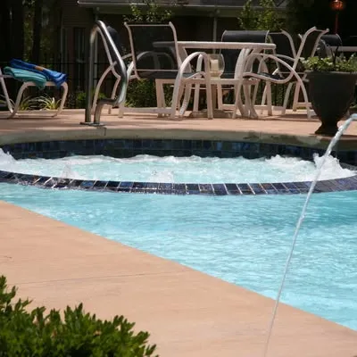 Family enjoying their new, spacious San Juan fiberglass pool.